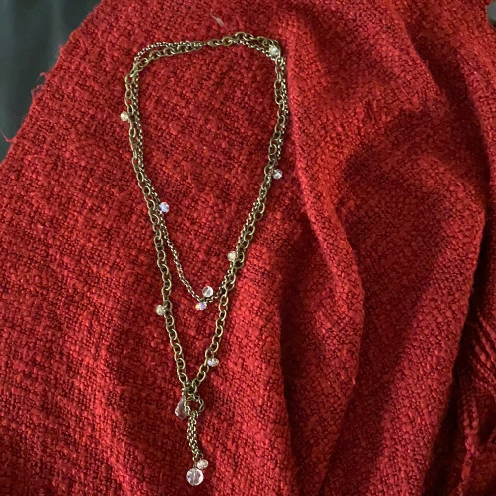Double necklace with crystal-like adornments